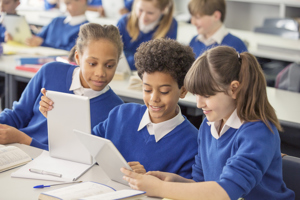 Pupils using tablets in classroom ?? title